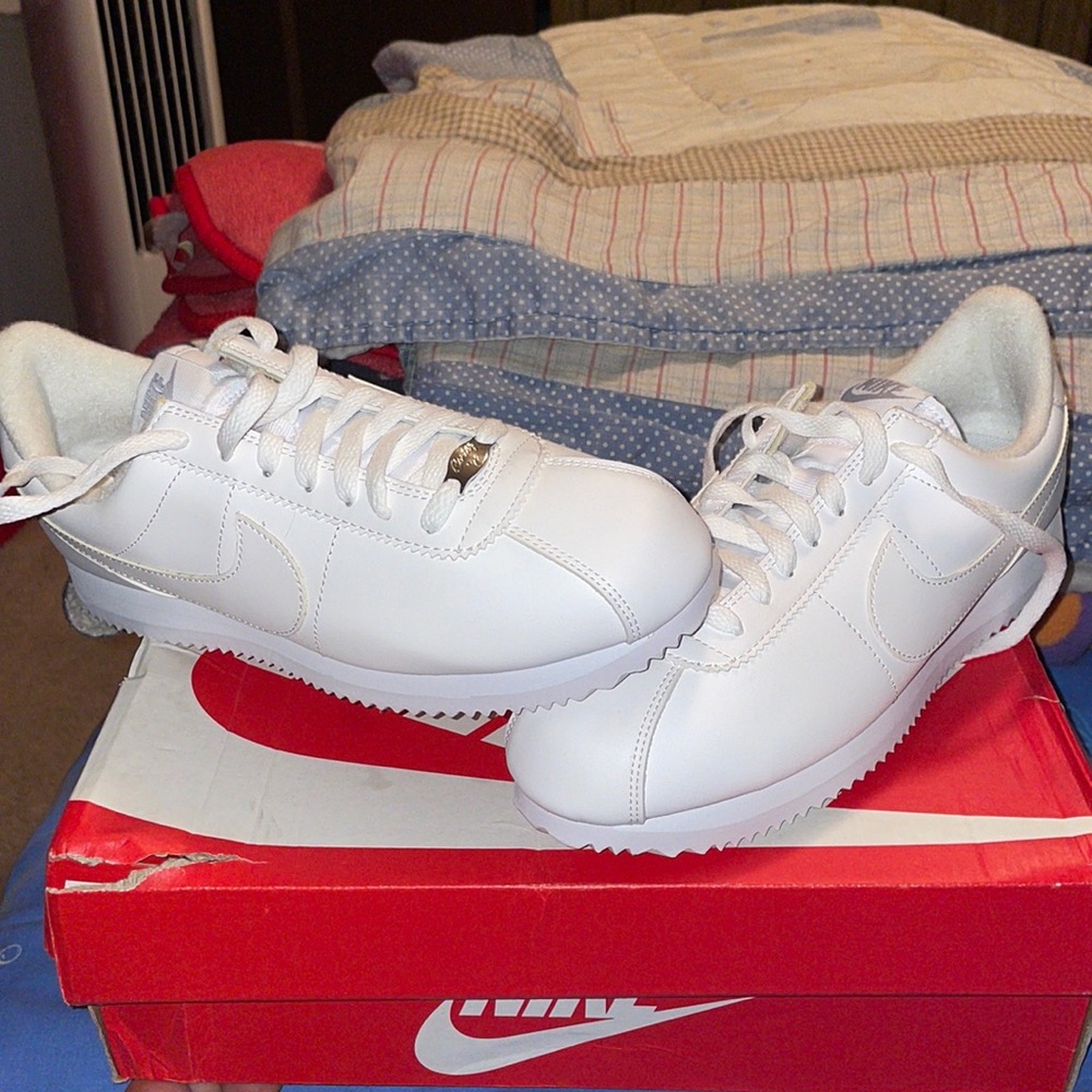Nike cortez, all white leather size 8, never worn. Box is slightly torn.